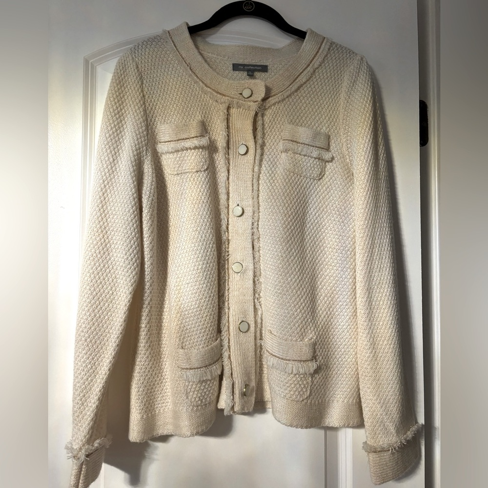 Women’s sweater with pearl buttons.